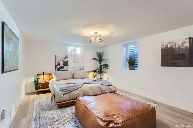 bedroom with light hardwood / wood-style flooring