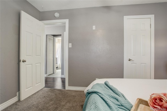 bedroom with dark carpet