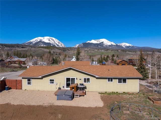 840 Mesa Dr, Silverthorne, CO 80498 - rear view of house with a mountain view and fence