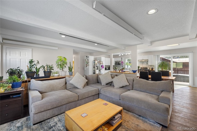 840 Mesa Dr, Silverthorne, CO 80498 - living area with a textured ceiling, wood finished floors, beamed ceiling, and recessed lighting