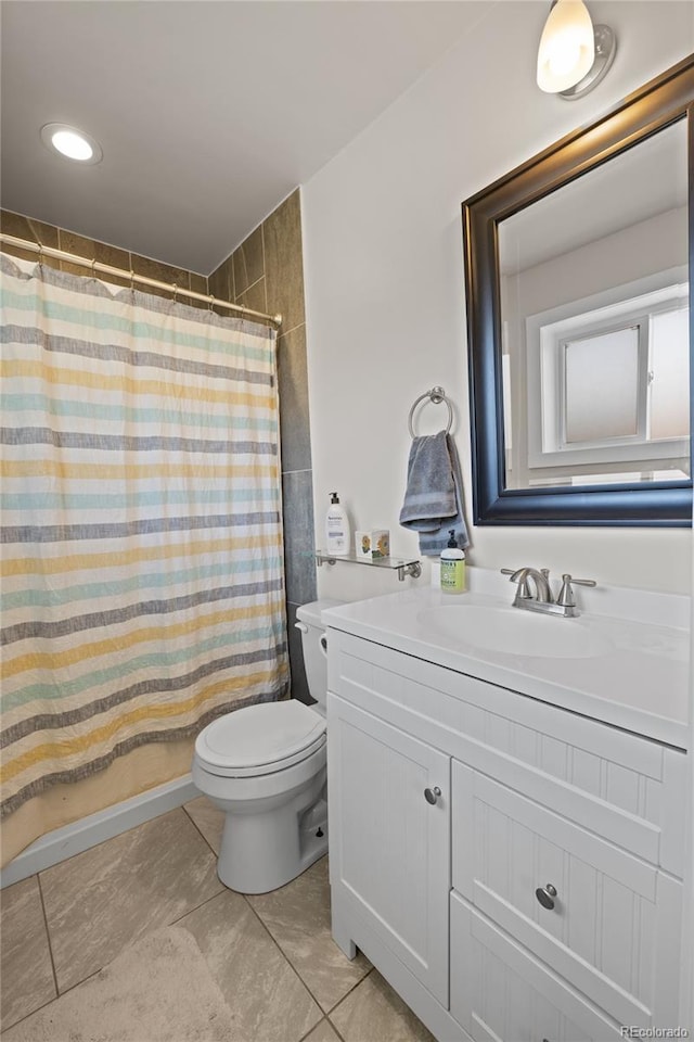 840 Mesa Dr, Silverthorne, CO 80498 - full bath featuring toilet, vanity, curtained shower, and tile patterned flooring