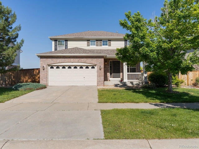 4816 S Elk Way, Aurora, CO 80016 - traditional-style home featuring brick siding, driveway, a garage, covered porch, and a shingled roof