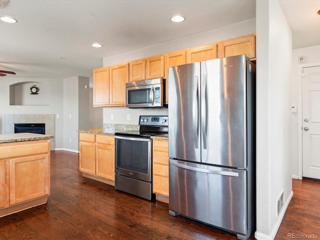 4816 S Elk Way, Aurora, CO 80016 - kitchen featuring appliances with stainless steel finishes, light brown cabinetry, dark wood-type flooring, and recessed lighting