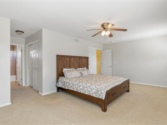 4816 S Elk Way, Aurora, CO 80016 - bedroom with light colored carpet, a ceiling fan, and a closet