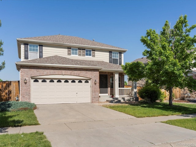 4816 S Elk Way, Aurora, CO 80016 - view of front facade featuring brick siding, concrete driveway, covered porch, and a shingled roof