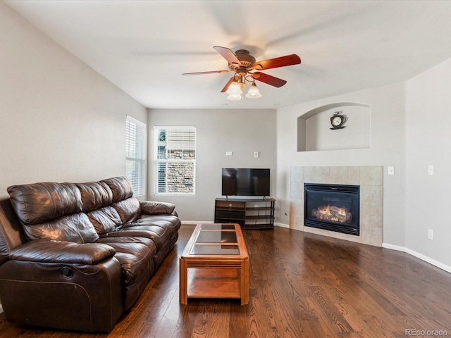 4816 S Elk Way, Aurora, CO 80016 - living area with wood finished floors, ceiling fan, and a tiled fireplace