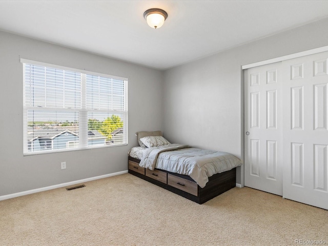 4816 S Elk Way, Aurora, CO 80016 - bedroom with light carpet and a closet