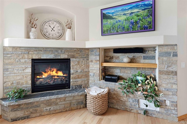 7724 Kryptonite Ln, Castle Rock, CO 80108 - detailed view of a stone fireplace and wood finished floors