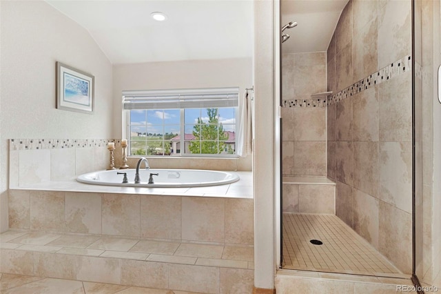 7724 Kryptonite Ln, Castle Rock, CO 80108 - bathroom with a stall shower, a bath, vaulted ceiling, and tile patterned floors