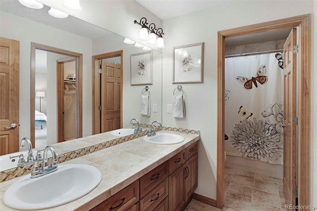 7724 Kryptonite Ln, Castle Rock, CO 80108 - ensuite bathroom featuring double vanity and tile patterned floors
