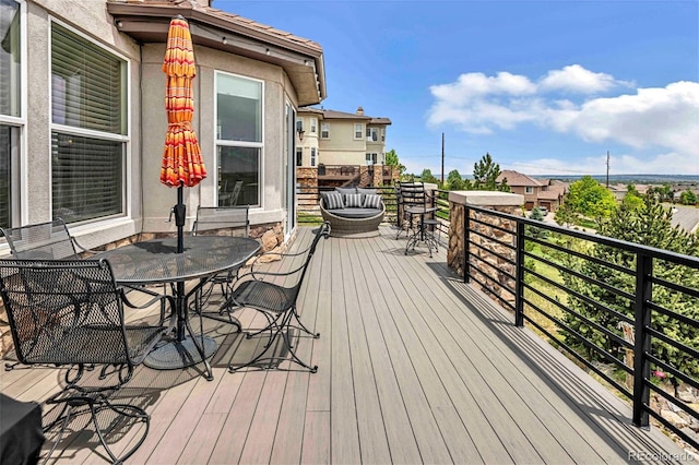 7724 Kryptonite Ln, Castle Rock, CO 80108 - wooden terrace with outdoor dining space