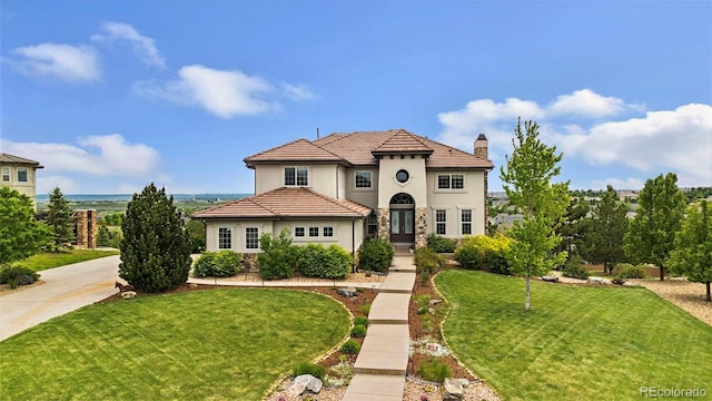 7724 Kryptonite Ln, Castle Rock, CO 80108 - mediterranean / spanish home featuring a chimney, a front yard, stucco siding, french doors, and stone siding
