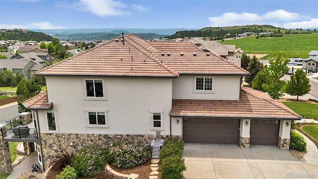 7724 Kryptonite Ln, Castle Rock, CO 80108 - view of front of property featuring stone siding, stucco siding, and driveway