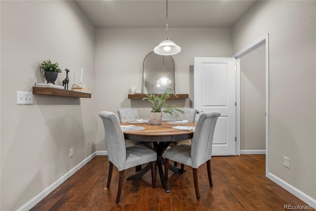 dining area with wood finished floors and baseboards