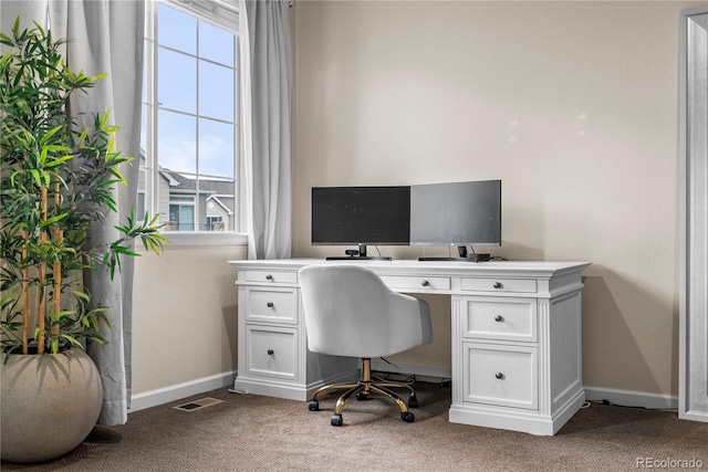 office with carpet flooring and baseboards