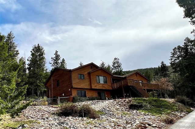 29825 Kennedy Gulch Rd, Conifer, CO 80433 - view of front of property with a wooden deck and stairway