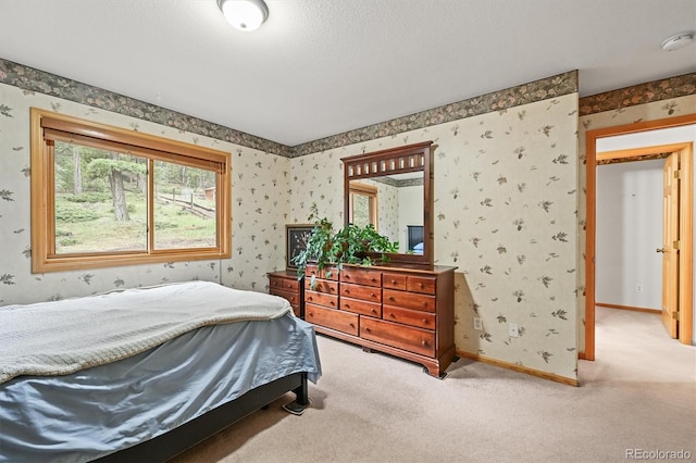 29825 Kennedy Gulch Rd, Conifer, CO 80433 - bedroom with wallpapered walls, light colored carpet, and baseboards