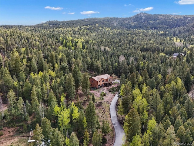 29825 Kennedy Gulch Rd, Conifer, CO 80433 - view of subject property with a forest and a mountainous background