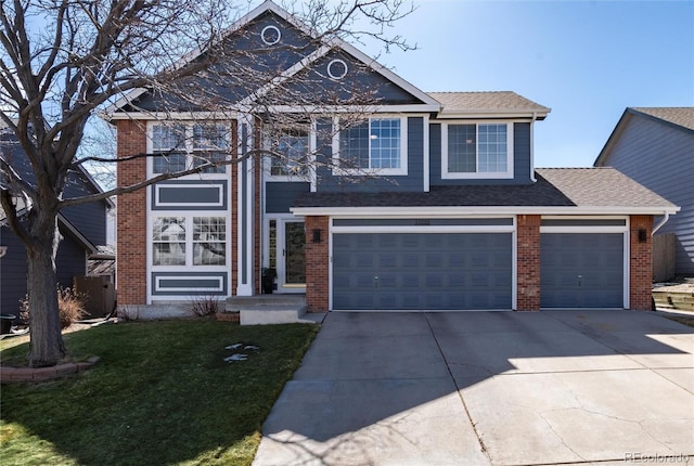 traditional-style home featuring a front yard, brick siding, driveway, and a shingled roof