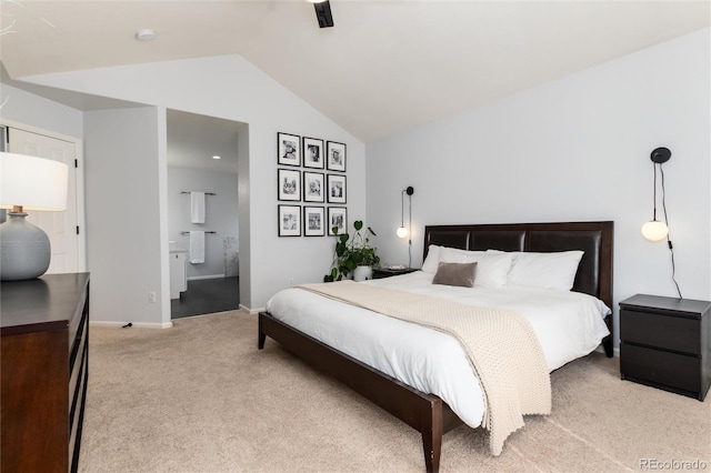 bedroom with light carpet, lofted ceiling, a ceiling fan, ensuite bath, and baseboards