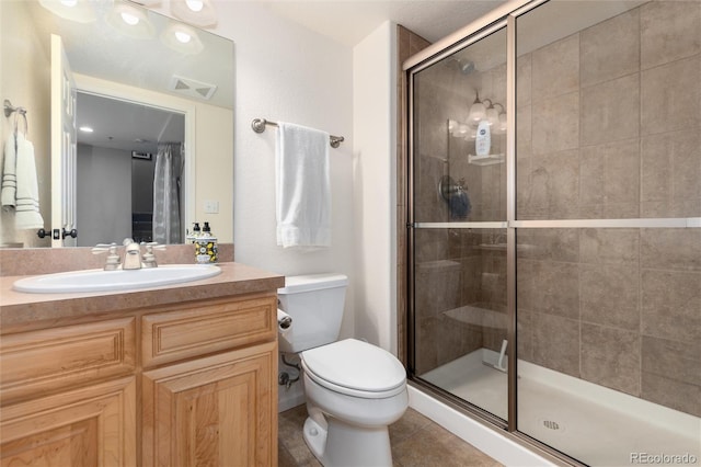 full bath with visible vents, toilet, a stall shower, tile patterned flooring, and vanity