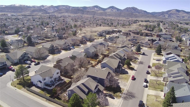 birds eye view of property with a mountain view and a residential view