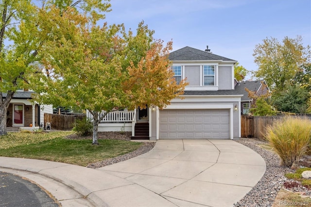 8510 Union Cir, Arvada, CO 80005 - view of front facade featuring stucco siding, a garage, concrete driveway, and a shingled roof