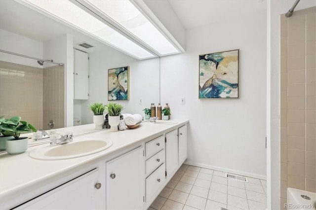8510 Union Cir, Arvada, CO 80005 - full bath featuring a shower, tile patterned floors, double vanity, and baseboards