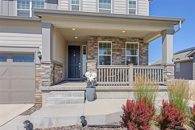 1061 S De Gaulle Ct, Aurora, CO 80018 - view of exterior entry featuring stone siding and a porch