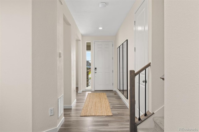 1061 S De Gaulle Ct, Aurora, CO 80018 - foyer featuring wood finished floors, stairway, and recessed lighting