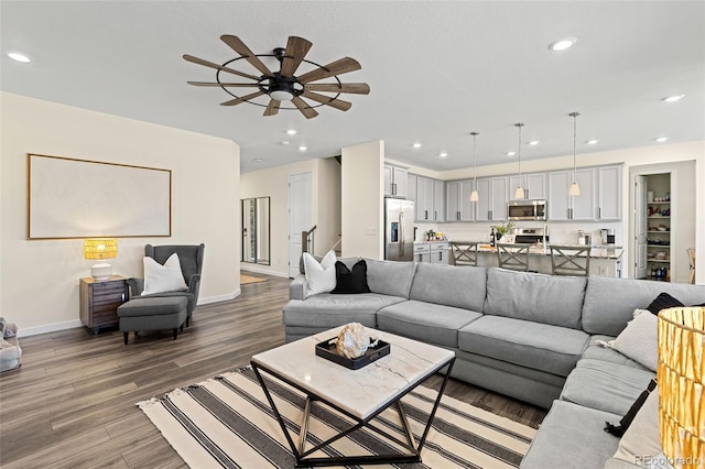 1061 S De Gaulle Ct, Aurora, CO 80018 - living area featuring light wood-style flooring, a ceiling fan, and recessed lighting