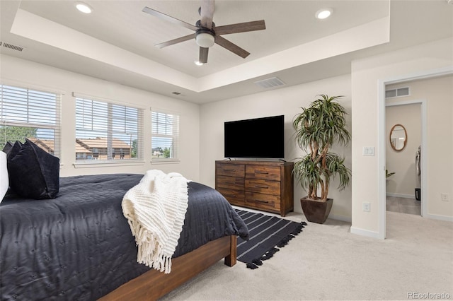 1061 S De Gaulle Ct, Aurora, CO 80018 - carpeted bedroom featuring a tray ceiling, recessed lighting, and a ceiling fan
