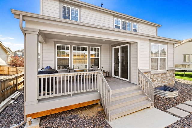 1061 S De Gaulle Ct, Aurora, CO 80018 - back of property with stone siding and a deck