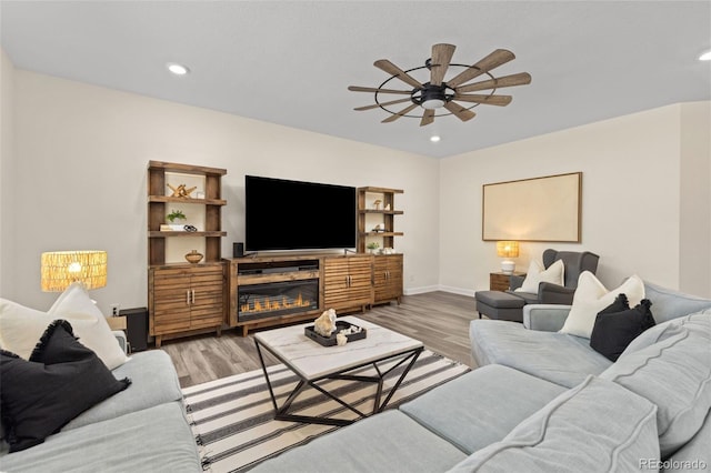 1061 S De Gaulle Ct, Aurora, CO 80018 - living area featuring ceiling fan, light wood-style floors, and recessed lighting