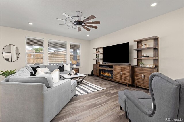 1061 S De Gaulle Ct, Aurora, CO 80018 - living room featuring a ceiling fan, light wood finished floors, and recessed lighting