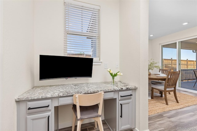 1061 S De Gaulle Ct, Aurora, CO 80018 - home office with built in study area, light wood-type flooring, and recessed lighting