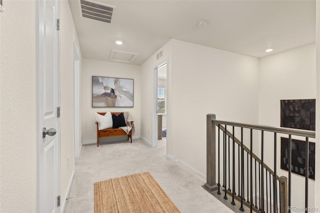 1061 S De Gaulle Ct, Aurora, CO 80018 - hall with an upstairs landing, carpet floors, attic access, and recessed lighting
