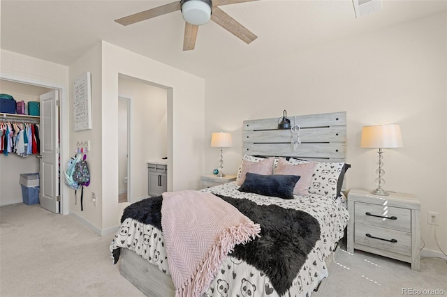 1061 S De Gaulle Ct, Aurora, CO 80018 - bedroom with carpet floors, ensuite bath, a walk in closet, and a ceiling fan