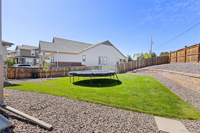 1061 S De Gaulle Ct, Aurora, CO 80018 - fenced backyard featuring a trampoline