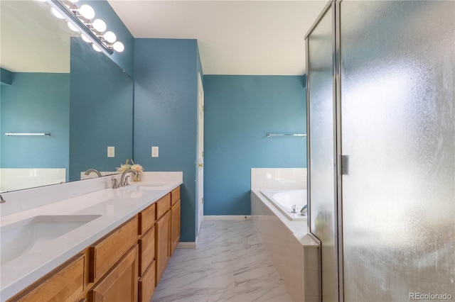 full bath with a stall shower, marble finish floor, a garden tub, and a sink