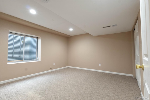 spare room featuring recessed lighting, carpet flooring, and baseboards