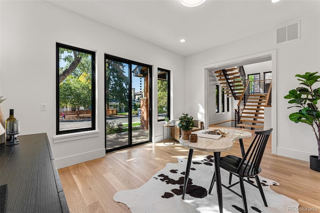 home office with light hardwood / wood-style floors