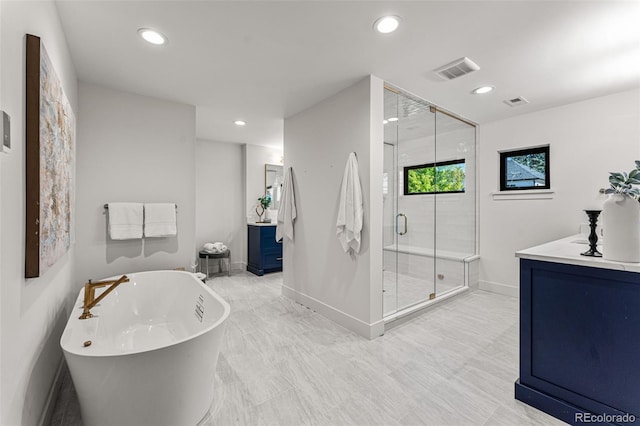 bathroom featuring vanity and plus walk in shower