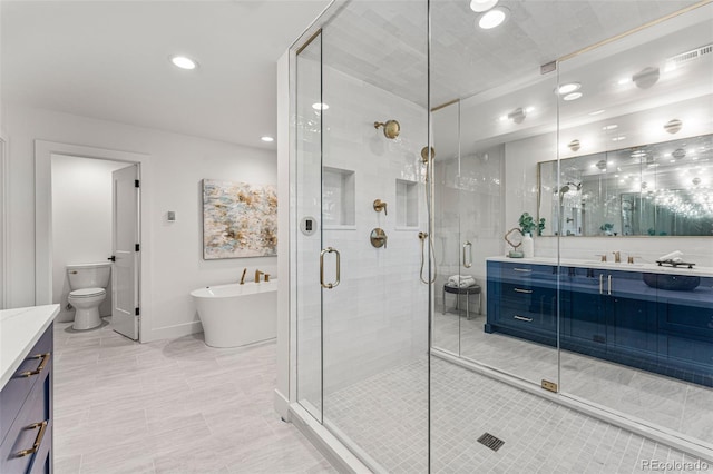 full bathroom featuring shower with separate bathtub, vanity, and toilet