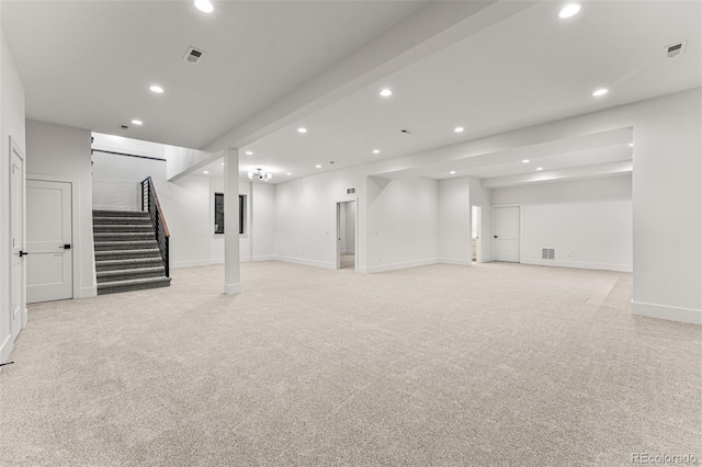 basement featuring light colored carpet