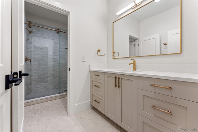 bathroom featuring walk in shower and vanity