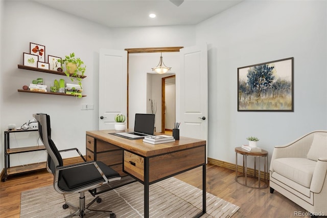 office area with hardwood / wood-style floors