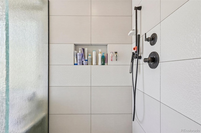bathroom view of a shower with shower door