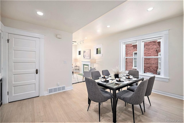 1021 E 23rd Ave, Denver, CO 80205 - dining area featuring light wood-type flooring, plenty of natural light, and recessed lighting