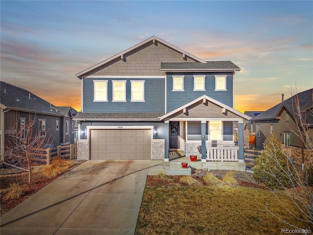 craftsman inspired home with stone siding, concrete driveway, a porch, and an attached garage